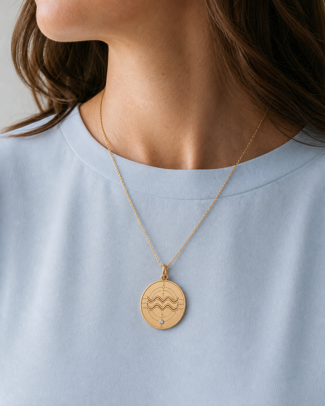 Aquarius Zodiac Pendant in 9K Gold worn on model